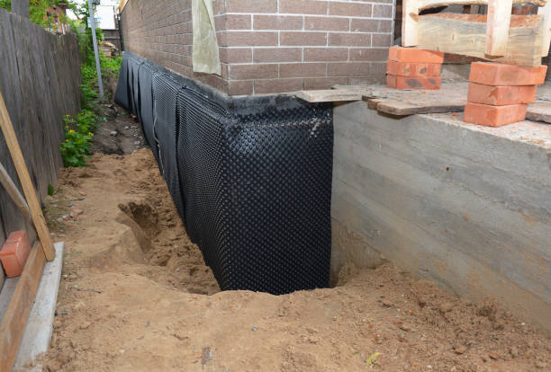 Happy homeowners after waterproofing job in Bay Shore